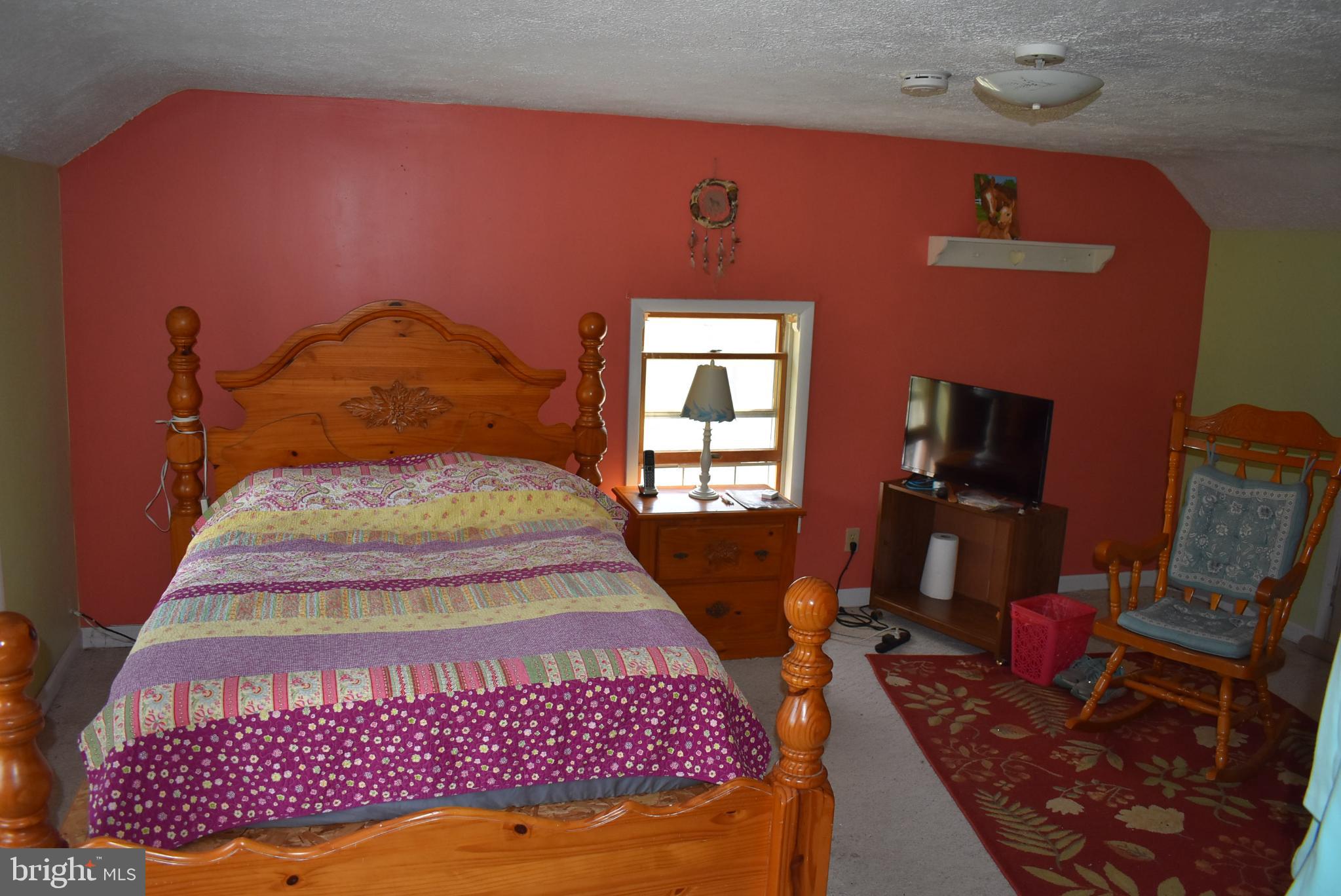 1971 Duckwall Road Berkeley Springs, WV 25411 - Photo 44 of 64 a bedroom with a bed and wooden floor