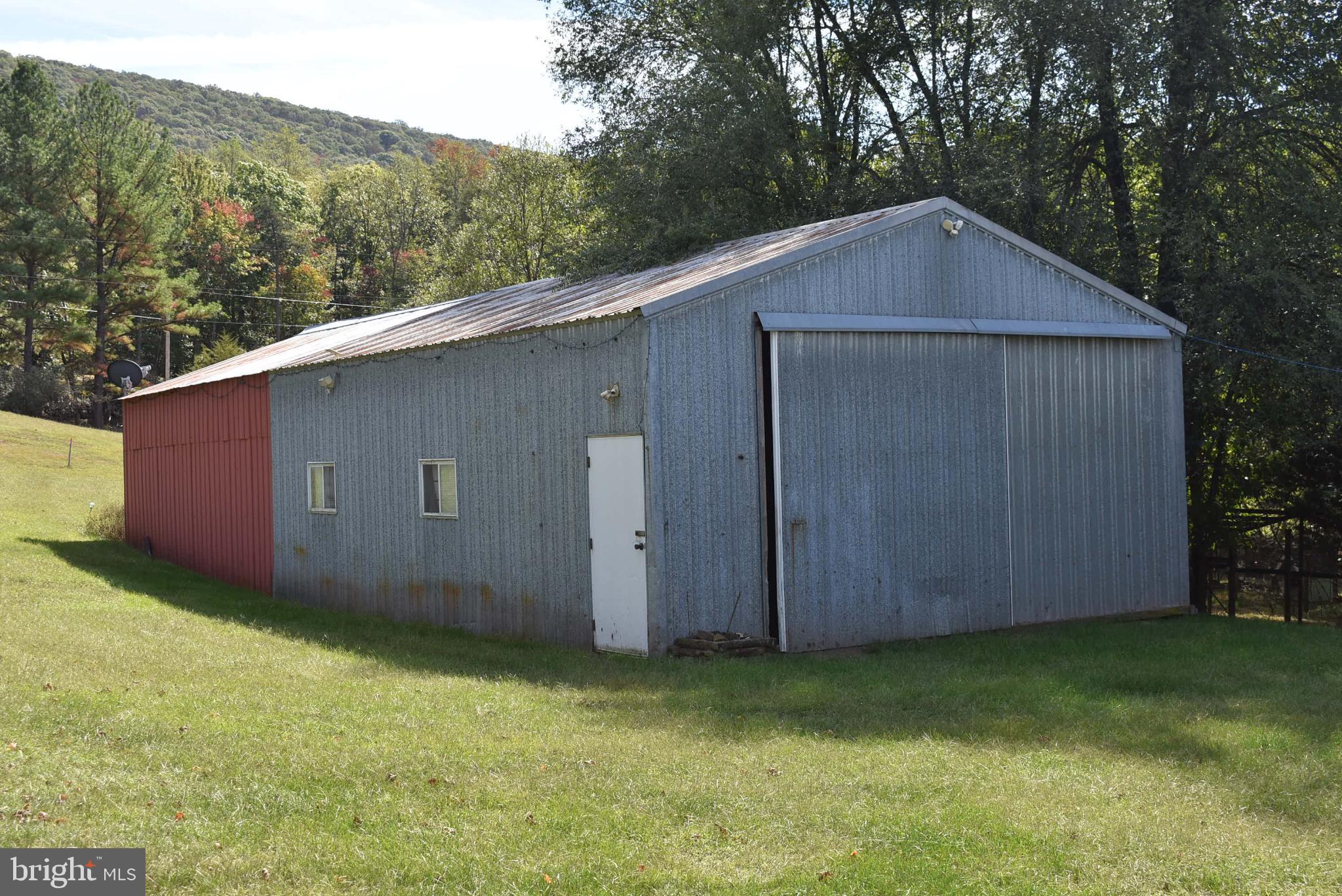 1971 Duckwall Road Berkeley Springs, WV 25411 - Photo 6 of 64 a backyard of a house with lots of green space