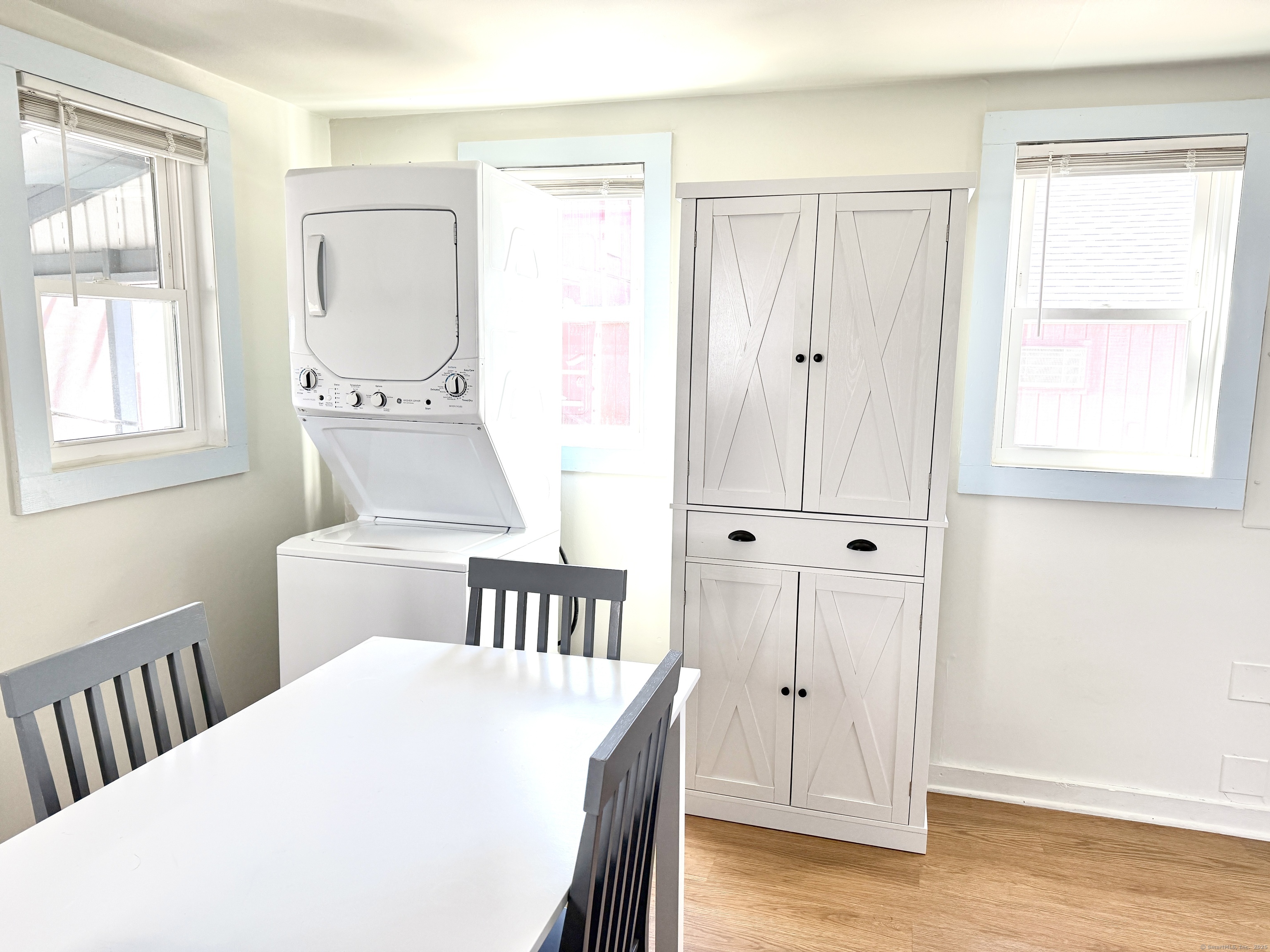 102 Chalker Beach Road Old Saybrook, CT 06475 - Photo 14 of 22 a bedroom with a bed and a window