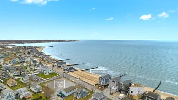 an aerial view of a house with a ocean view