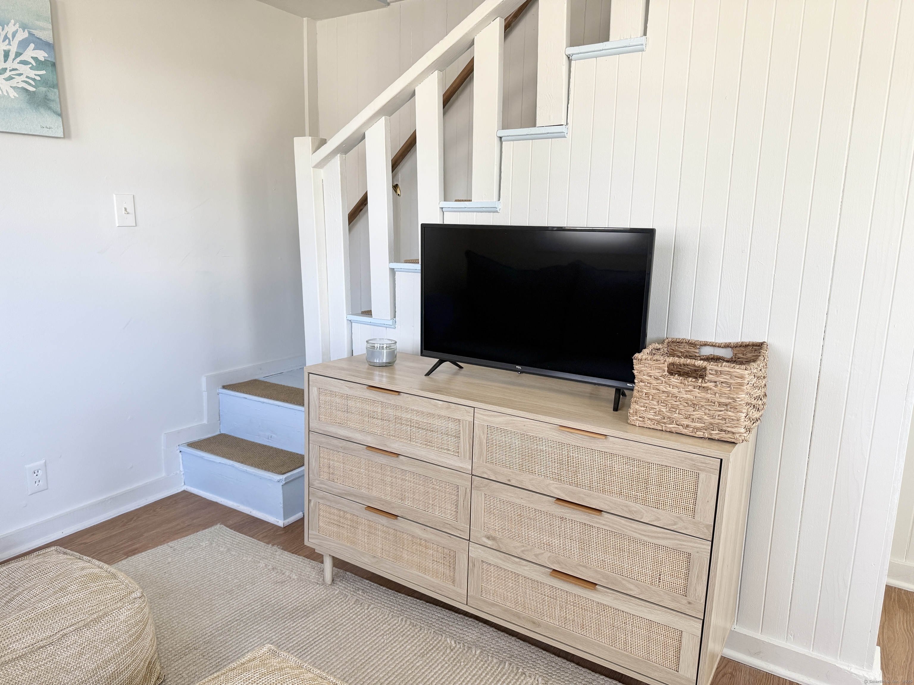 102 Chalker Beach Road Old Saybrook, CT 06475 - Photo 8 of 22 a living room with furniture and flat screen tv