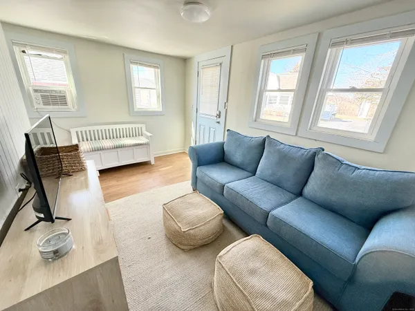 a living room with furniture and a window
