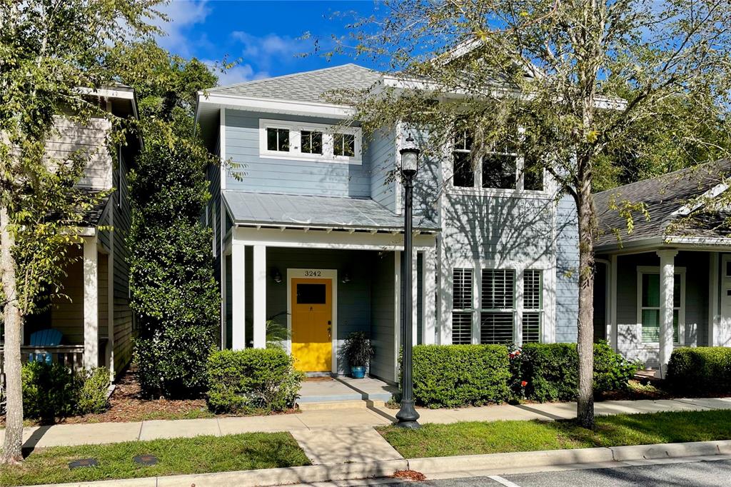 3242 Northwest 23rd Road Gainesville, FL 32605 - Photo 1 of 1 a front view of a house with garden and porch