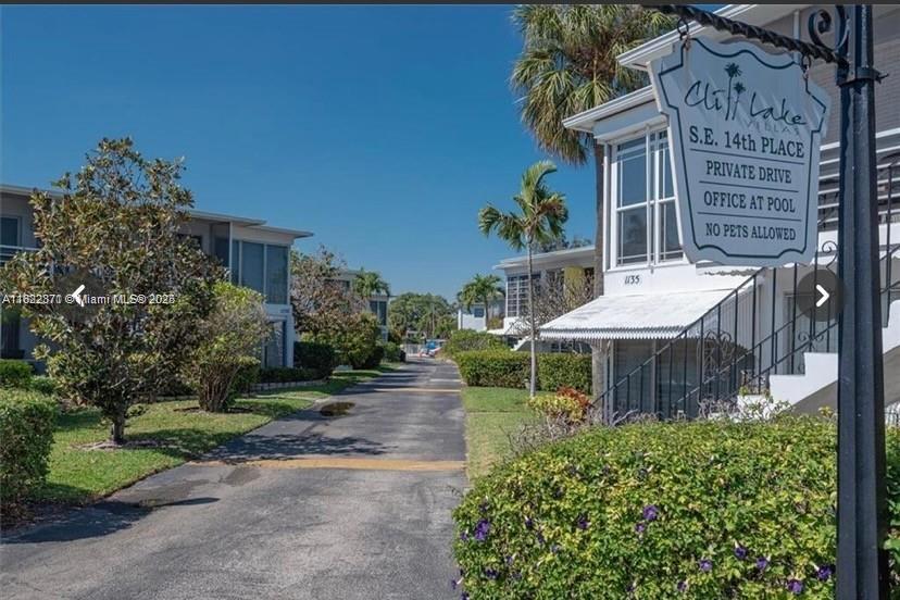 1125 Southeast 14th Place, Unit 21C Fort Lauderdale, FL 33316 - Photo 11 of 18 front view of a house with a yard