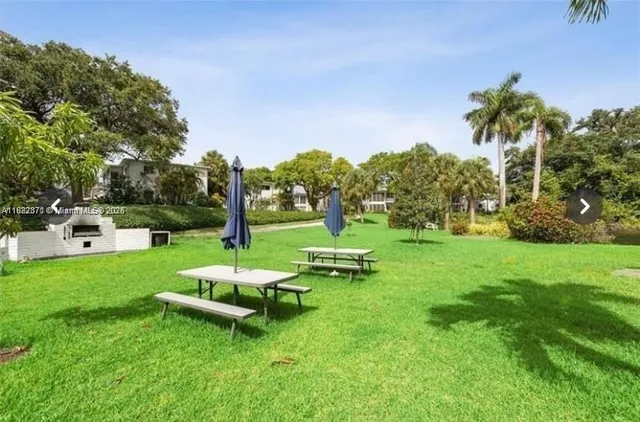 a view of a lake with a yard