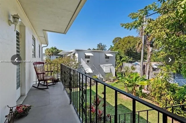 a view of balcony with furniture