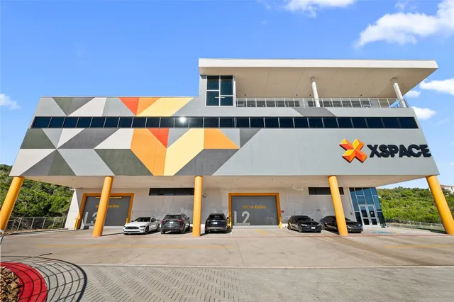 a outdoor view of a building with traffic signal lights