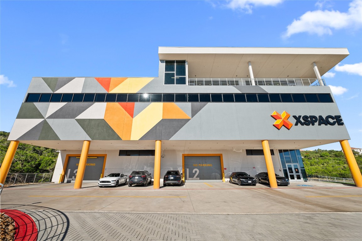 4229 North FM 620, Unit 331 Austin, TX 78734 - Photo 24 of 29 a view of a building with car parked