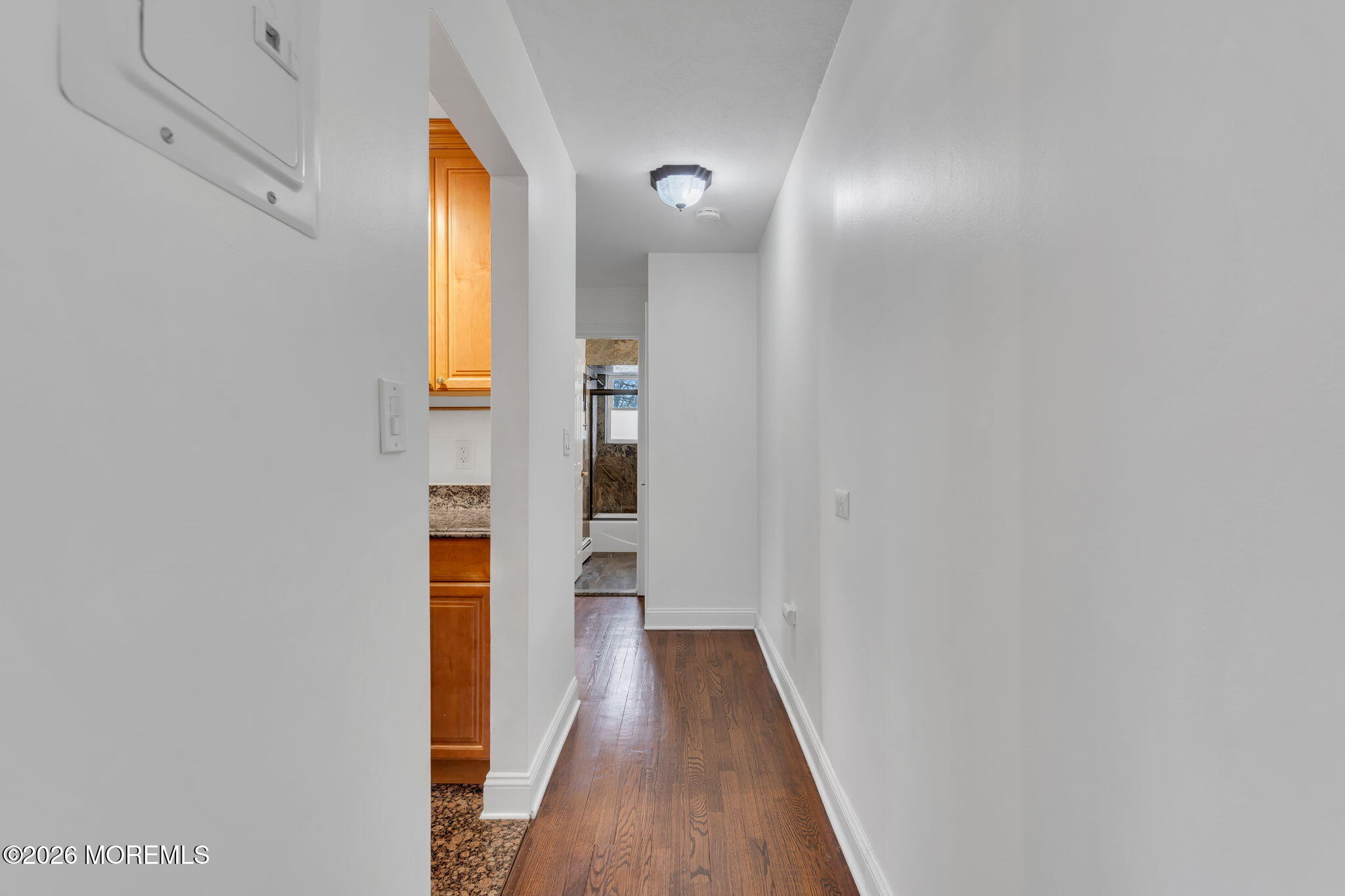 26 Windsor Terrace, Unit E Freehold, NJ 07728 - Photo 13 of 20 a view of a bathroom with wooden floor and a window