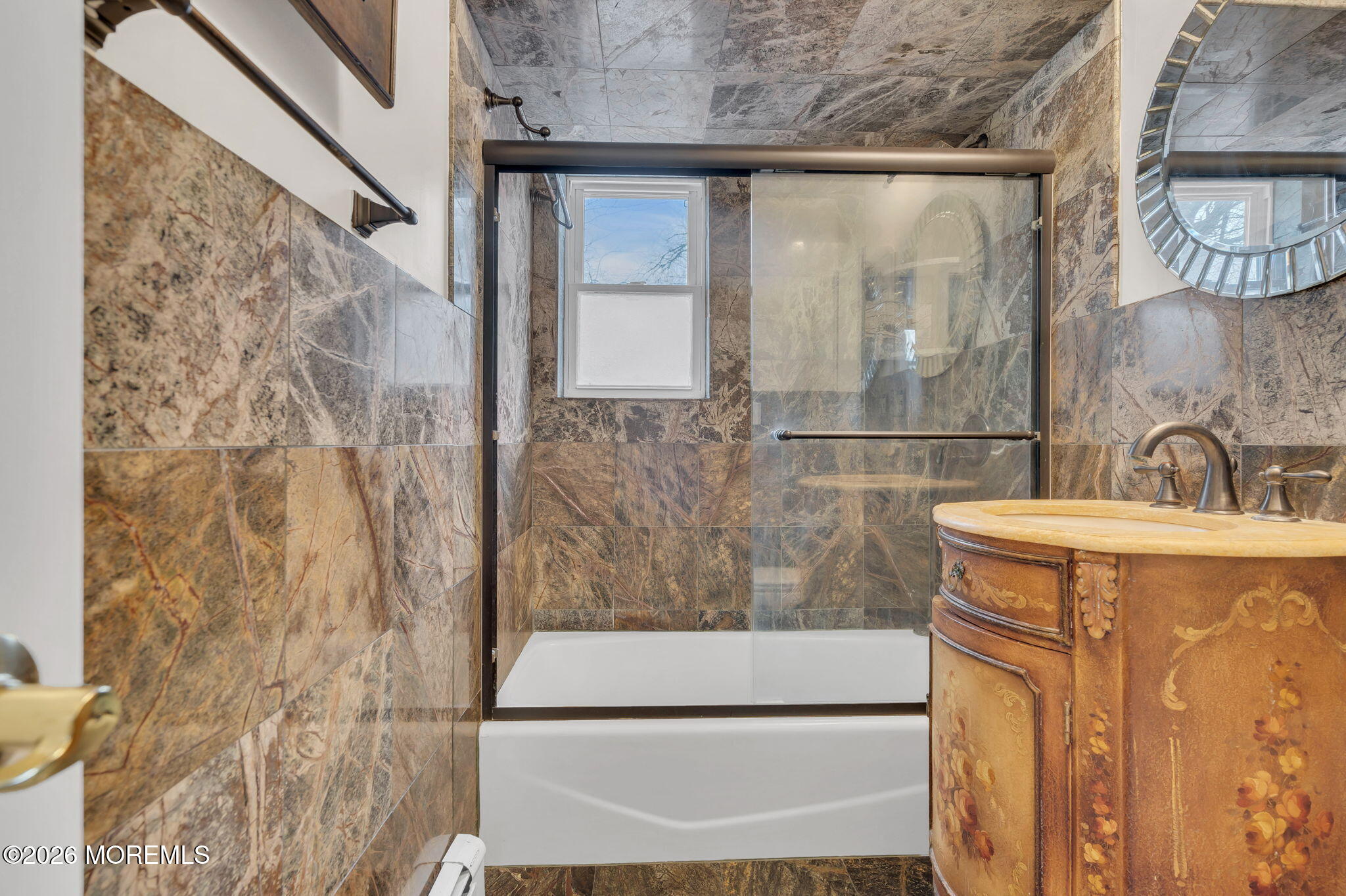 26 Windsor Terrace, Unit E Freehold, NJ 07728 - Photo 17 of 20 a bathroom with a sink and a mirror