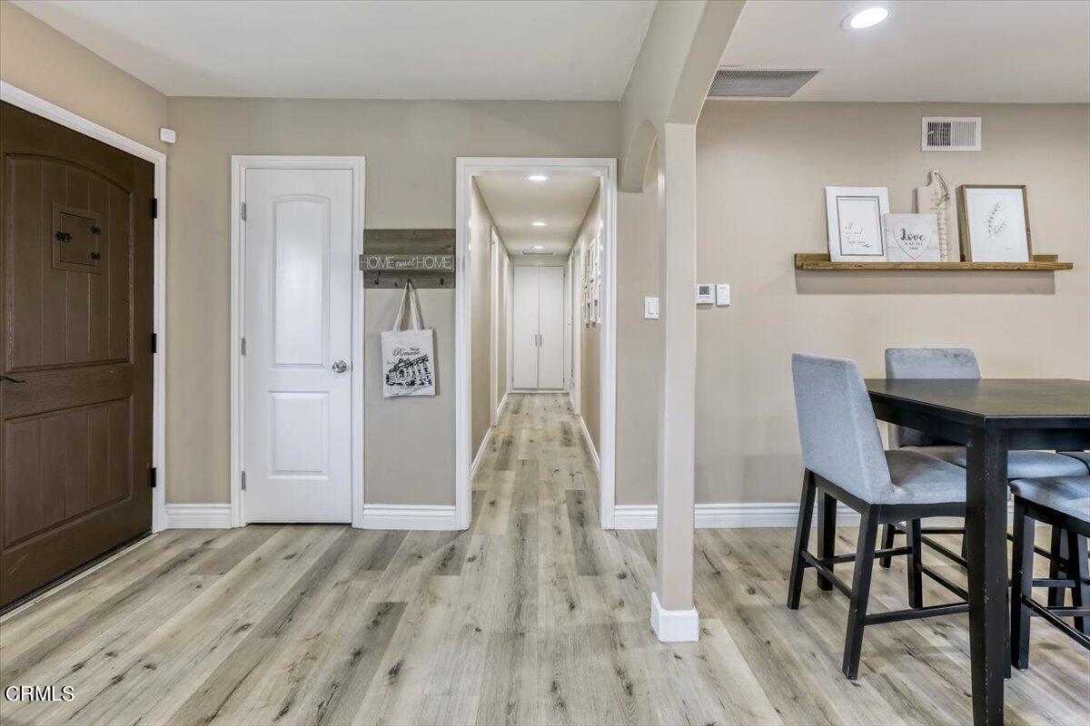 635 Oleander Drive Oxnard, CA 93033 - Photo 18 of 37 a view of a dining room with furniture and wooden floor