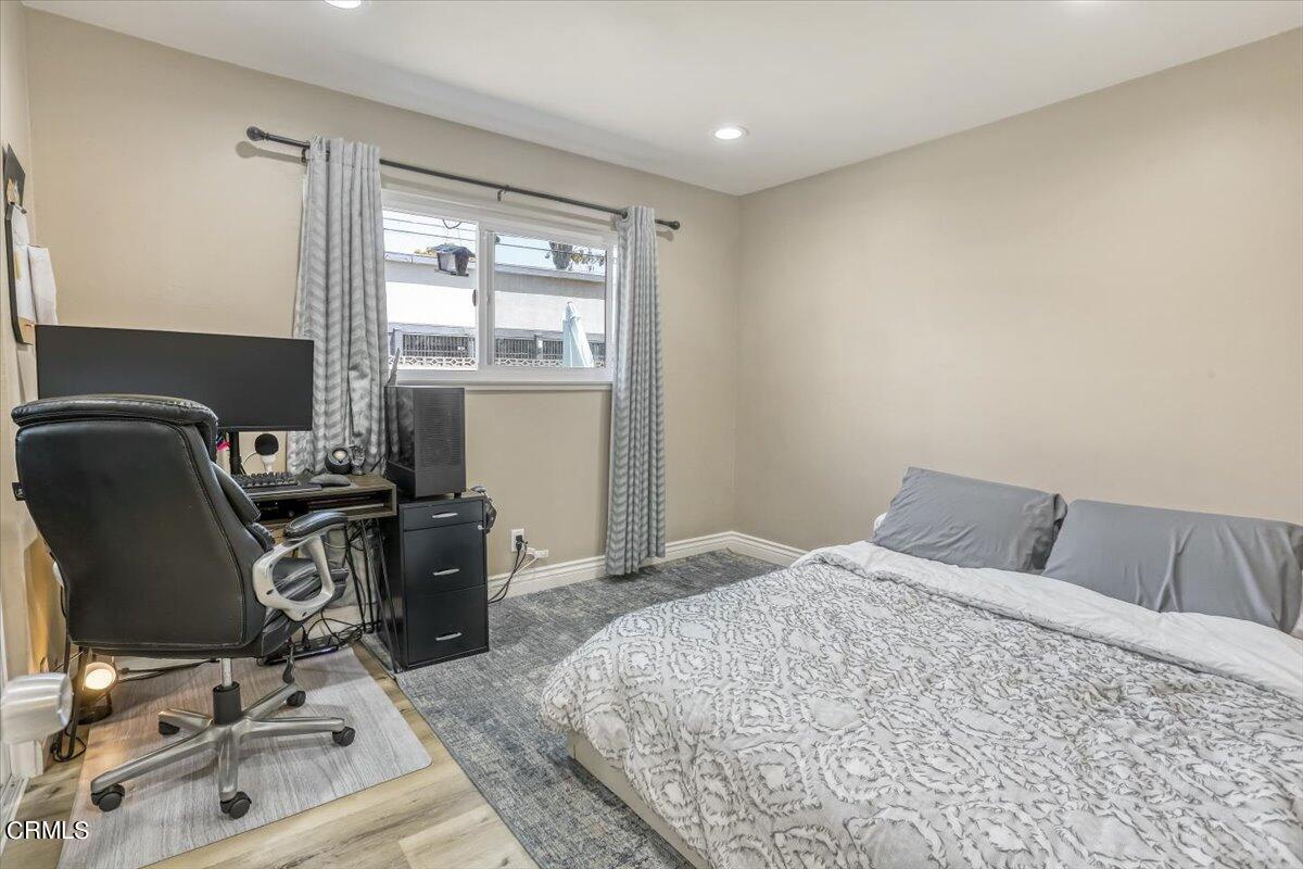 635 Oleander Drive Oxnard, CA 93033 - Photo 19 of 37 a bedroom with a bed and chair