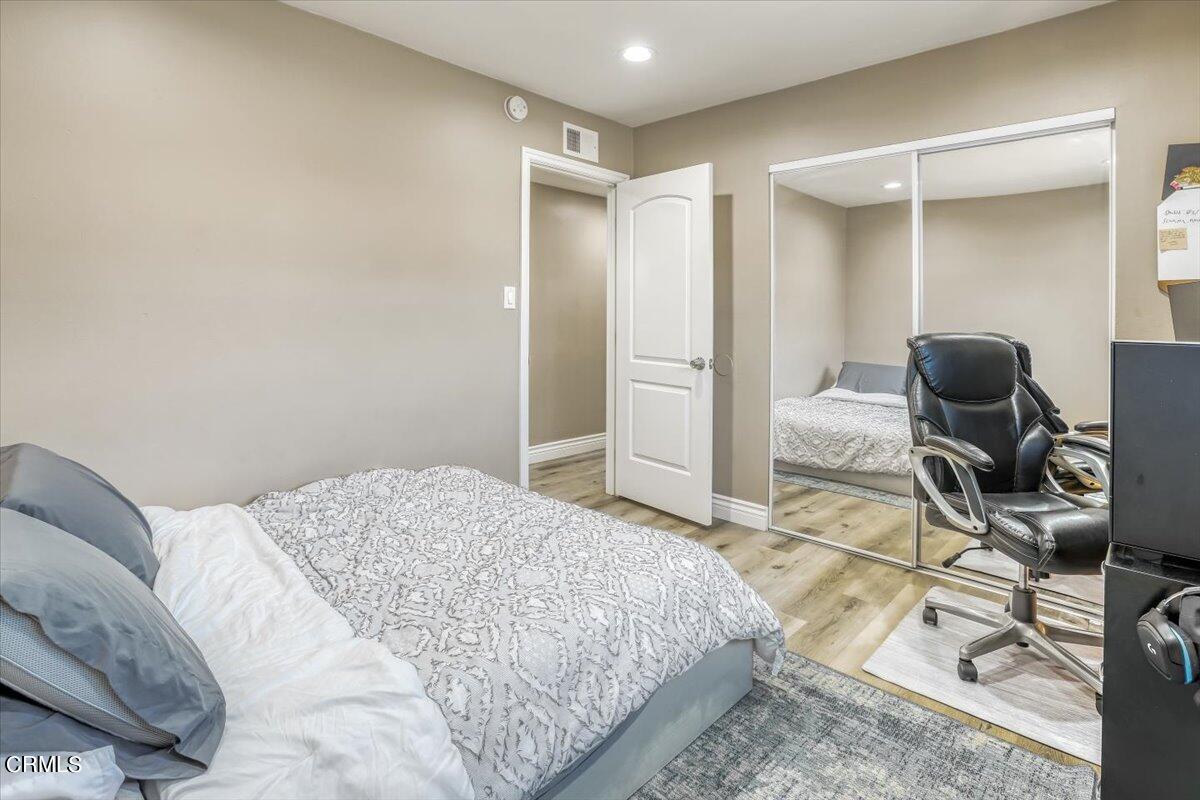 635 Oleander Drive Oxnard, CA 93033 - Photo 20 of 37 a bedroom with a bed and a chair