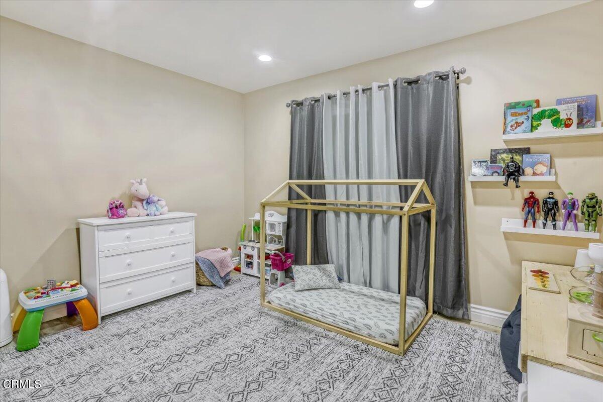 635 Oleander Drive Oxnard, CA 93033 - Photo 24 of 37 a storage room with a baby crib and toys