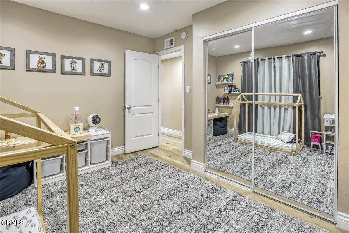 635 Oleander Drive Oxnard, CA 93033 - Photo 25 of 37 a view of a bathroom with a sink and mirror