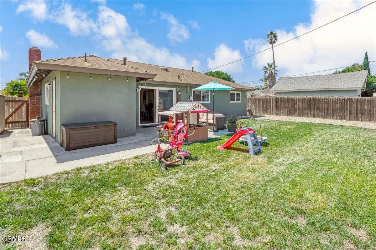 635 Oleander Drive Oxnard, CA 93033 - Photo 33 of 37 a backyard of a house with table and chairs