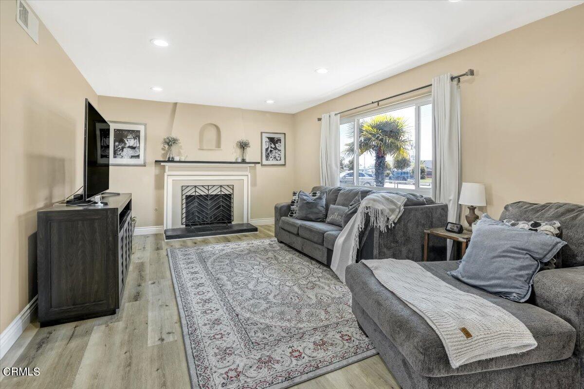 635 Oleander Drive Oxnard, CA 93033 - Photo 5 of 37 a living room with furniture and a fireplace