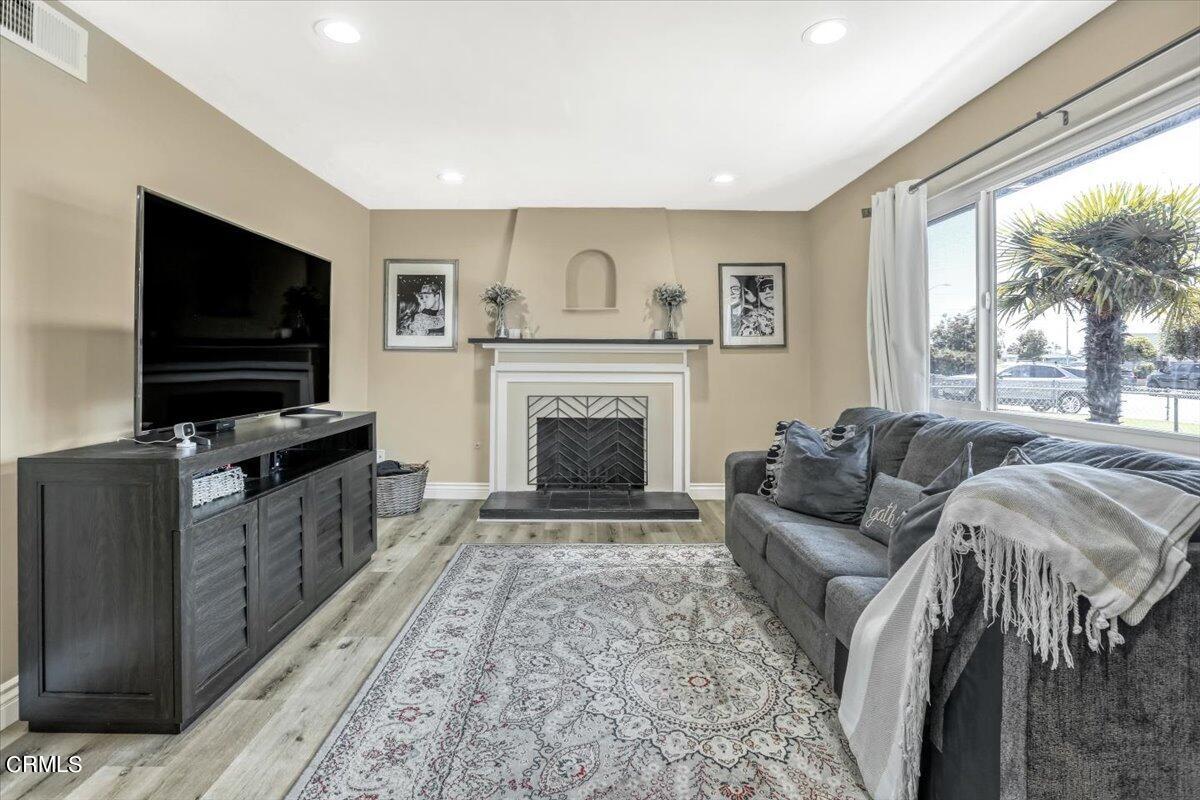 635 Oleander Drive Oxnard, CA 93033 - Photo 6 of 37 a living room with furniture and a flat screen tv