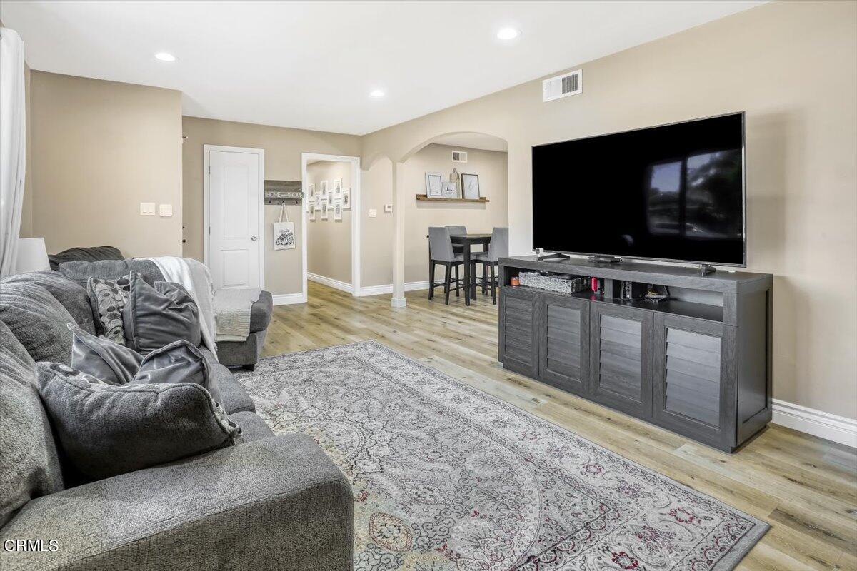 635 Oleander Drive Oxnard, CA 93033 - Photo 7 of 37 a living room with furniture and a flat screen tv