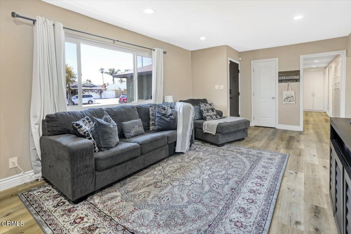 635 Oleander Drive Oxnard, CA 93033 - Photo 8 of 37 a living room with furniture and a large window
