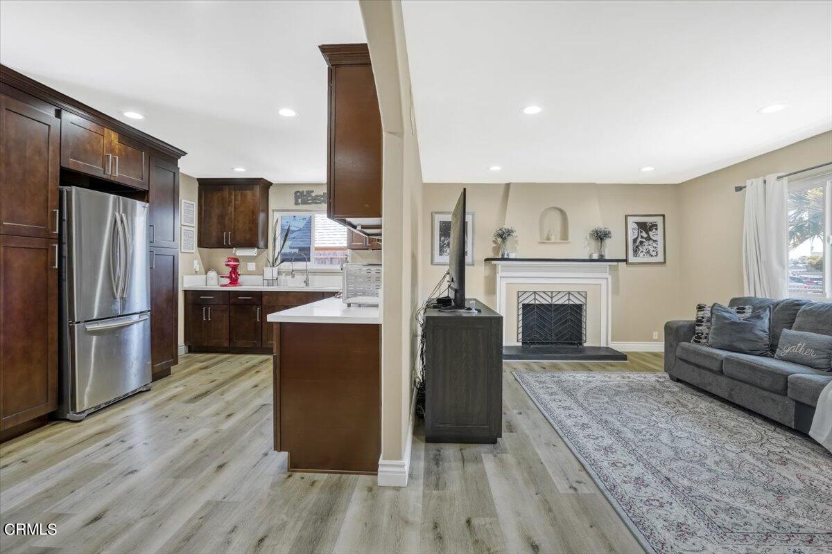 635 Oleander Drive Oxnard, CA 93033 - Photo 10 of 37 a living room with furniture and a fireplace