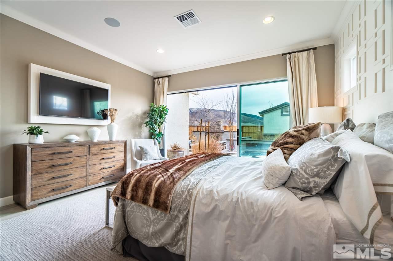 2860 Ethelinda Way, Unit LOT 13 Reno, NV 89521 - Photo 11 of 23 a bedroom with a bed and a flat screen tv