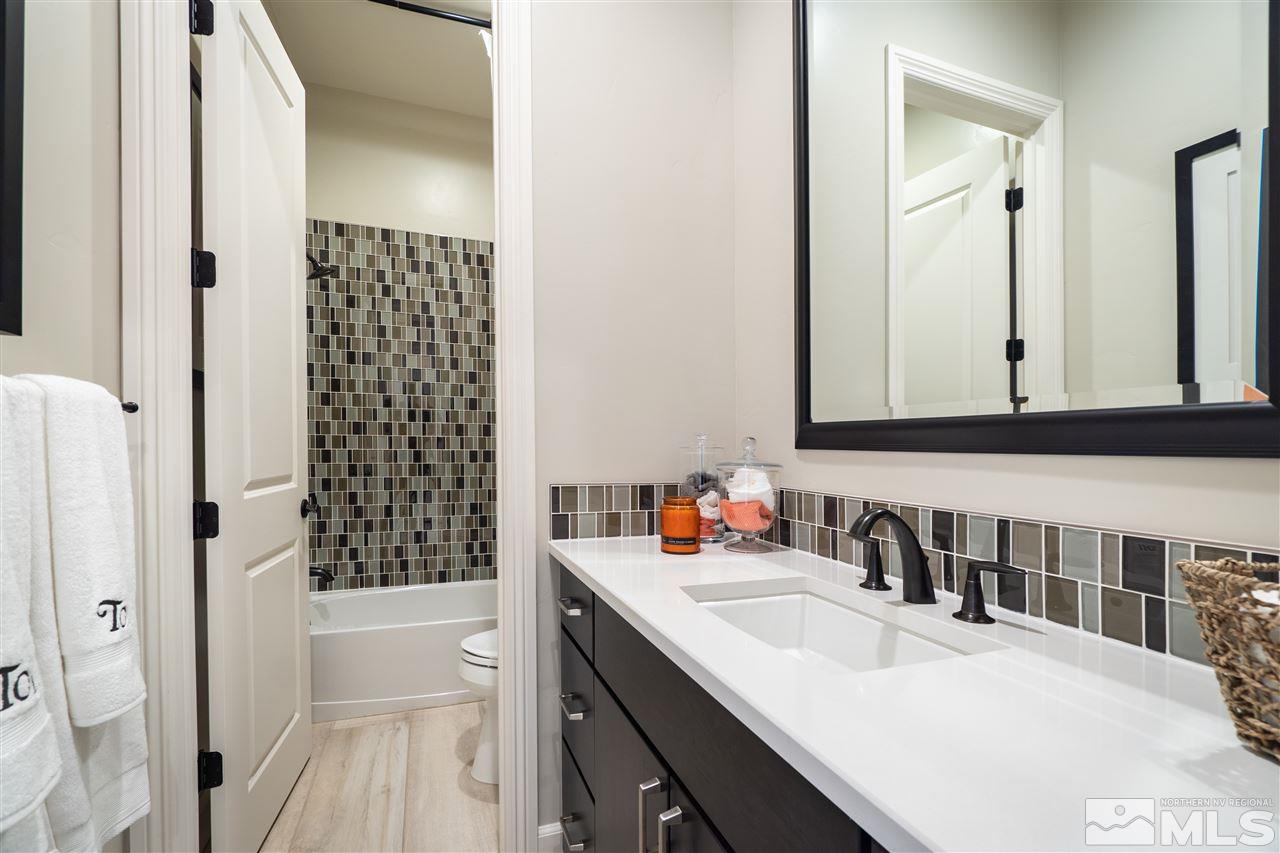 2860 Ethelinda Way, Unit LOT 13 Reno, NV 89521 - Photo 15 of 23 a bathroom with double vanity sink and a mirror