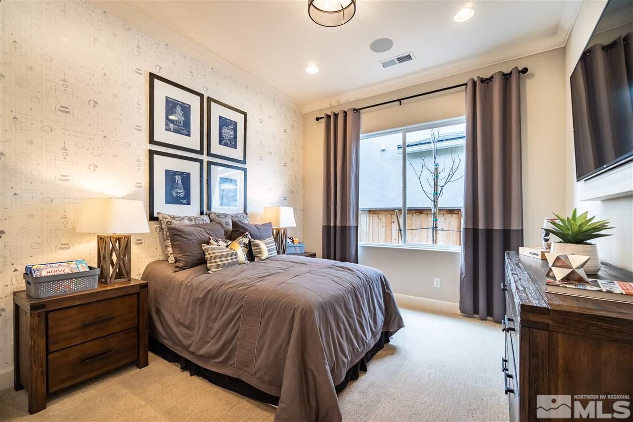 2860 Ethelinda Way, Unit LOT 13 Reno, NV 89521 - Photo 19 of 23 a bedroom with a large bed and a window