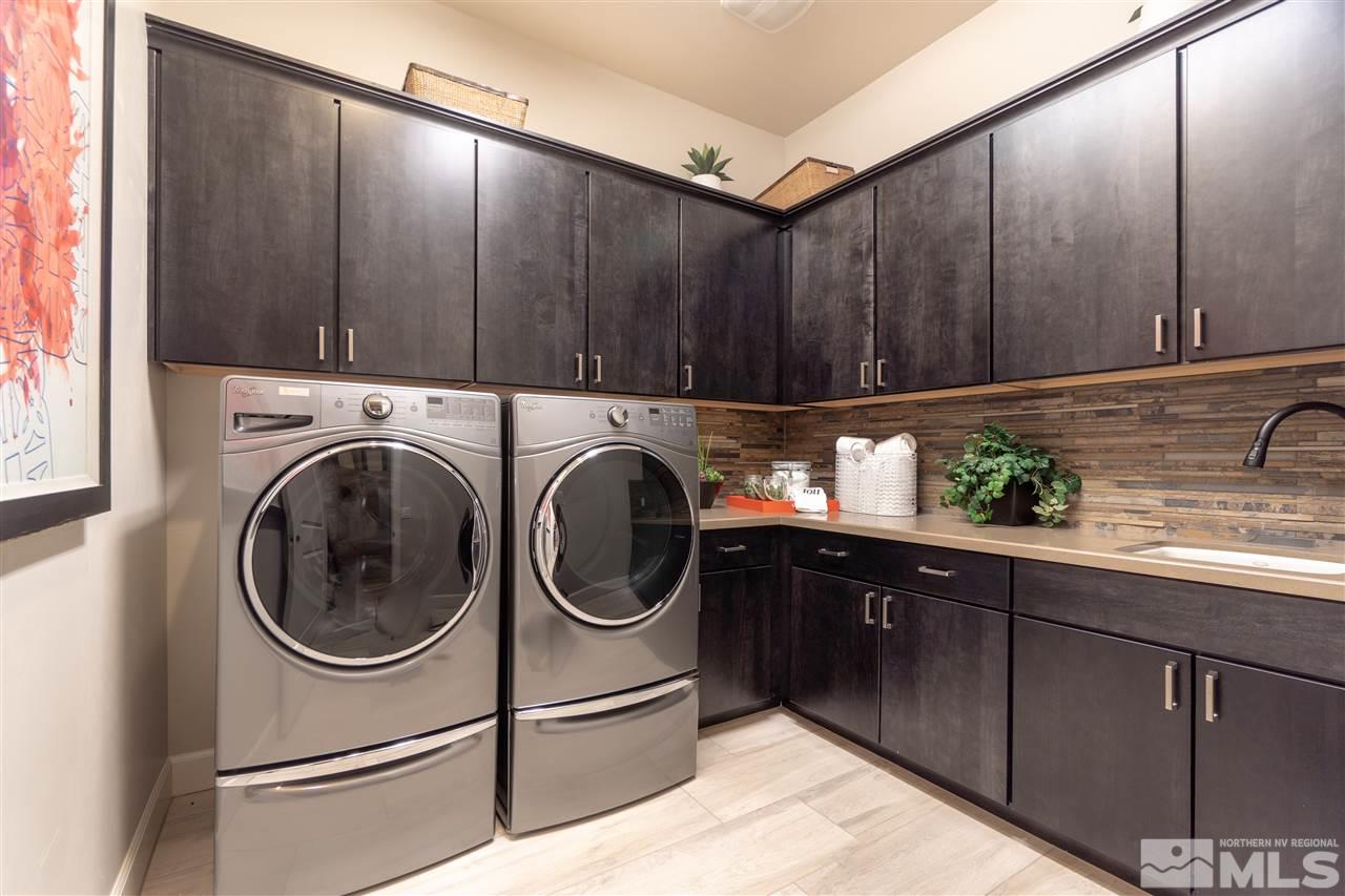 2860 Ethelinda Way, Unit LOT 13 Reno, NV 89521 - Photo 23 of 23 a kitchen with a sink a washer and dryer