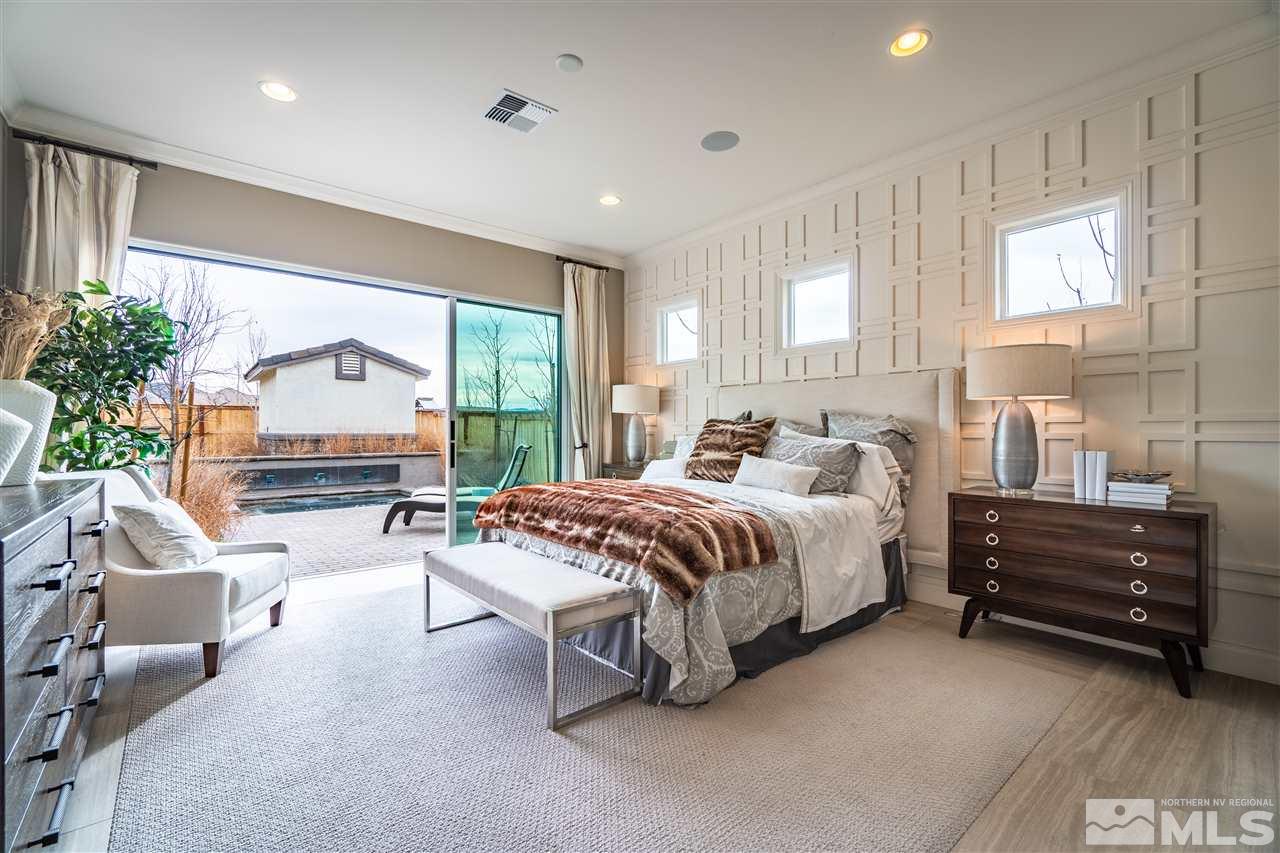 2860 Ethelinda Way, Unit LOT 13 Reno, NV 89521 - Photo 10 of 23 a spacious bedroom with a bed and a large window