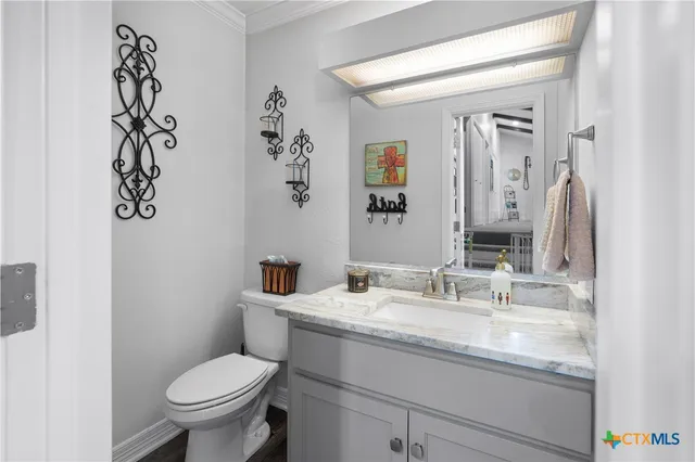 a kitchen with stainless steel appliances granite countertop a sink dishwasher stove and refrigerator