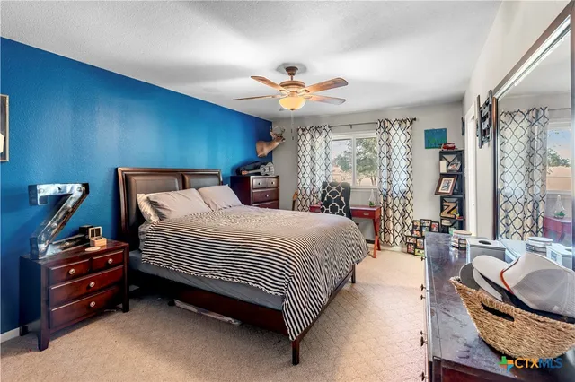 a living room with furniture fireplace and flat screen tv