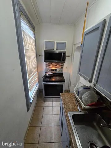 a kitchen with a stove and a sink