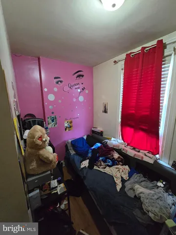 a room with furniture and a floor to ceiling window