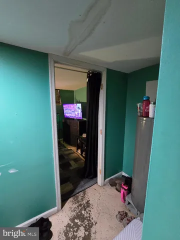 a bedroom with a bed and a mirror