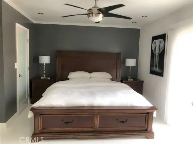 a bedroom with a bed and a table