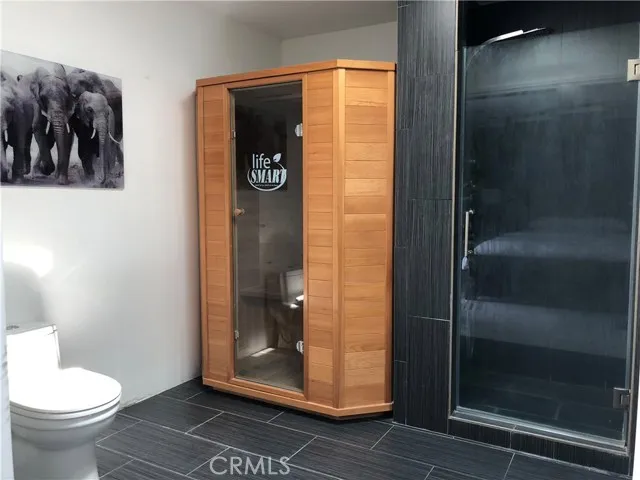 71292 Biskra Road Rancho Mirage, CA 92270 - Photo 14 of 27 a bathroom with a toilet and a shower