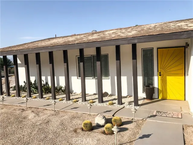 71292 Biskra Road Rancho Mirage, CA 92270 - Photo 25 of 27 a view of a swimming pool with outdoor seating