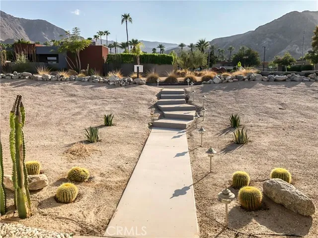 71292 Biskra Road Rancho Mirage, CA 92270 - Photo 27 of 27 a view of a terrace with furniture and a fireplace