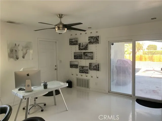 71292 Biskra Road Rancho Mirage, CA 92270 - Photo 3 of 27 a view of a livingroom with furniture and windows