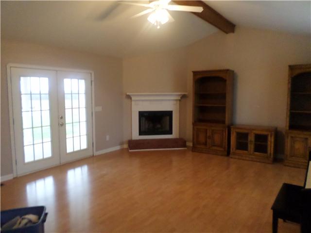 1156 Young Road Lebanon, TN 37090 - Photo 11 of 20 an empty room with fireplace and windows