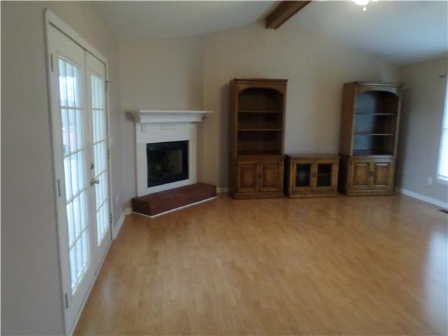 1156 Young Road Lebanon, TN 37090 - Photo 12 of 20 an empty room with furniture and a fireplace