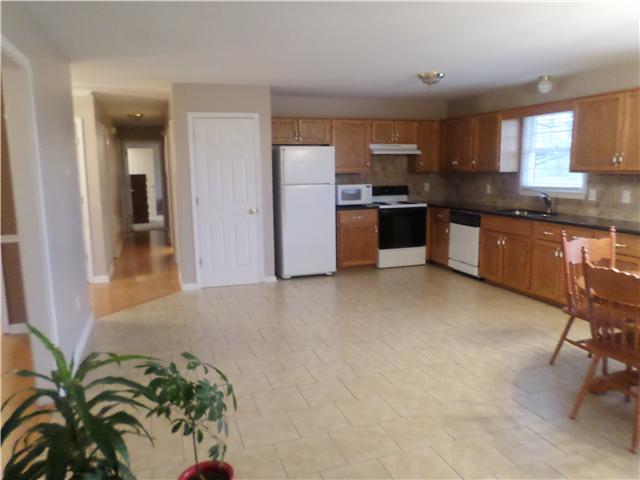 1156 Young Road Lebanon, TN 37090 - Photo 15 of 20 a kitchen with stainless steel appliances a sink a stove top oven a counter space and cabinets
