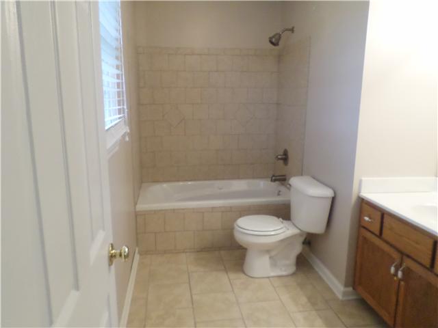 1156 Young Road Lebanon, TN 37090 - Photo 19 of 20 a bathroom with a toilet and a bathtub