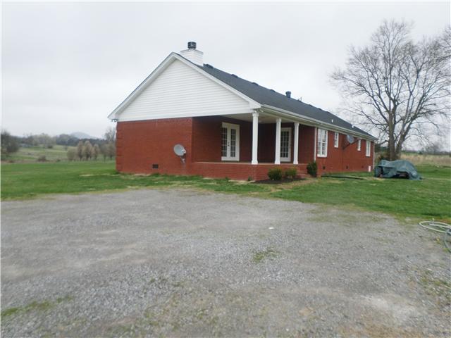 1156 Young Road Lebanon, TN 37090 - Photo 5 of 20 a front view of a house with a yard and garage