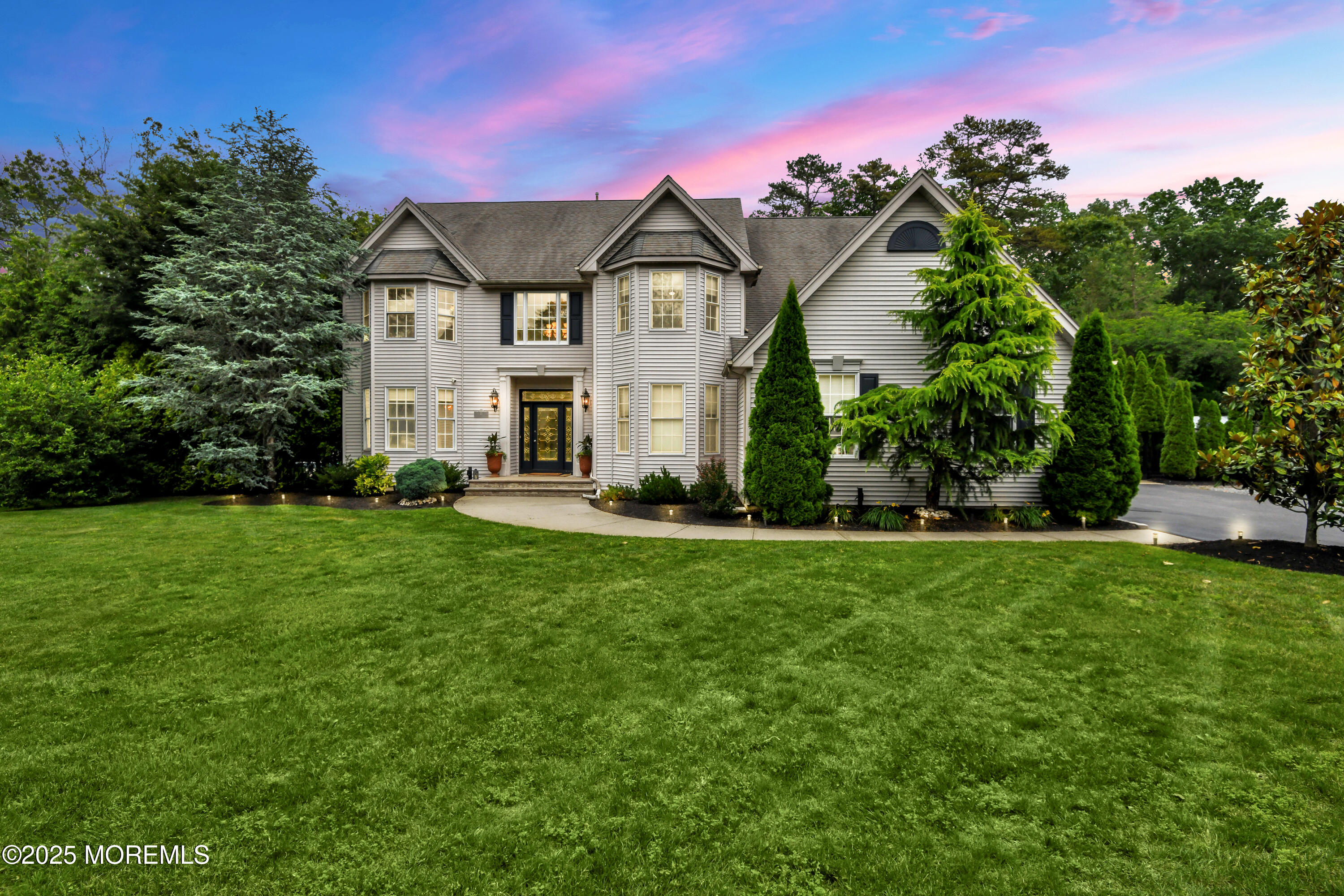 a front view of a house with a yard