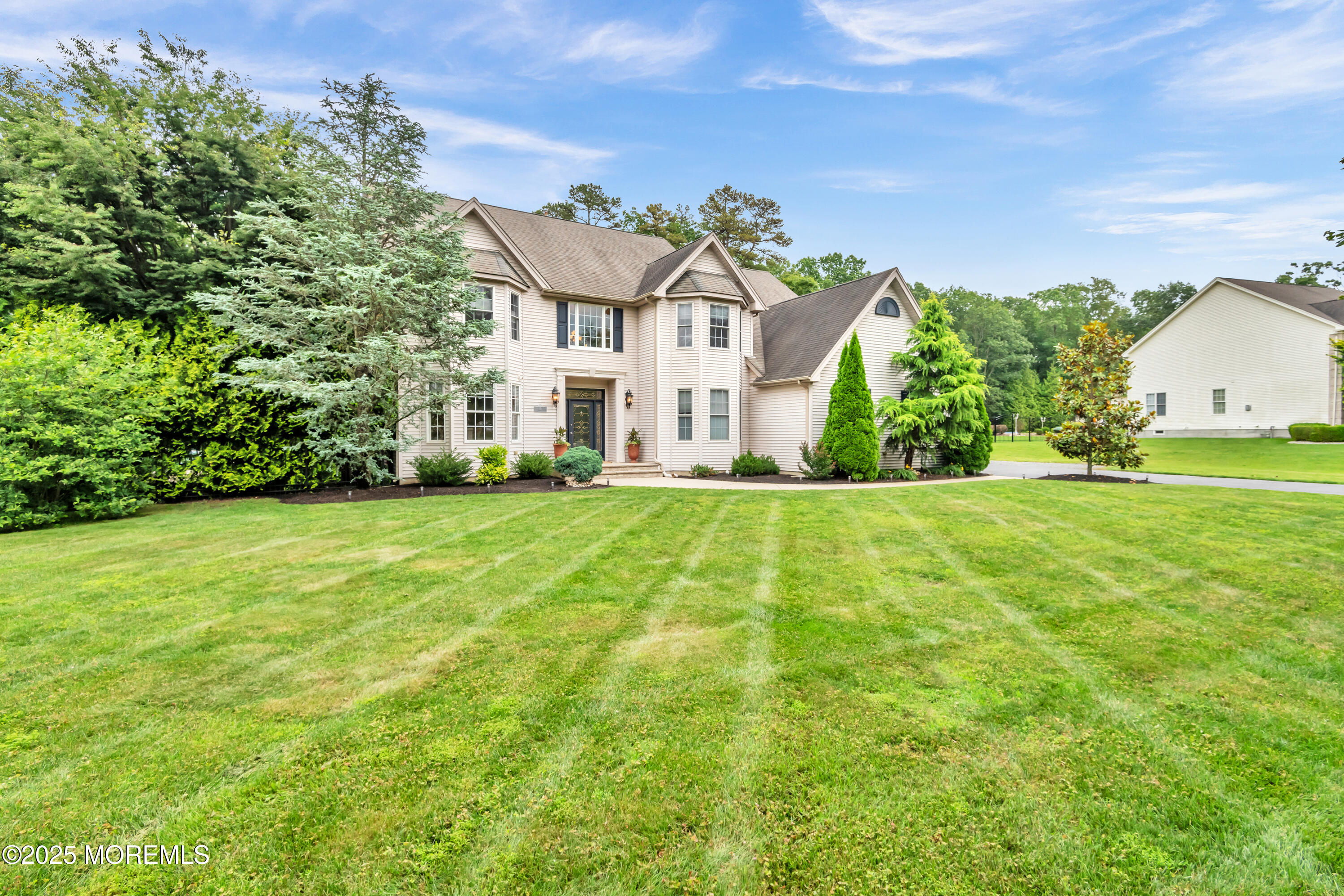 15 Conor Road Jackson, NJ 08527 - Photo 13 of 77 a view of a big house with a big yard and large trees