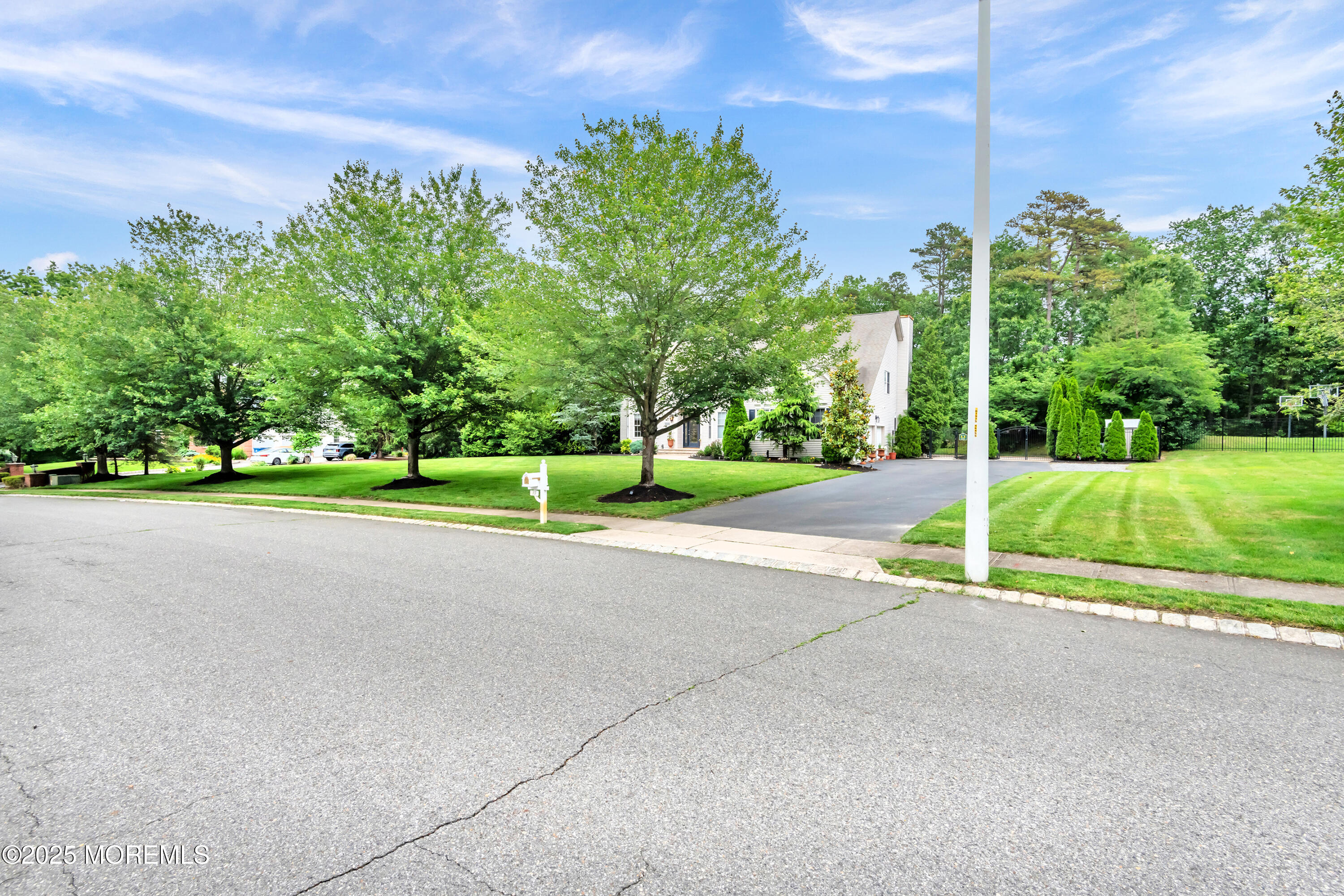 15 Conor Road Jackson, NJ 08527 - Photo 14 of 77 a view of a house with a big yard and palm trees