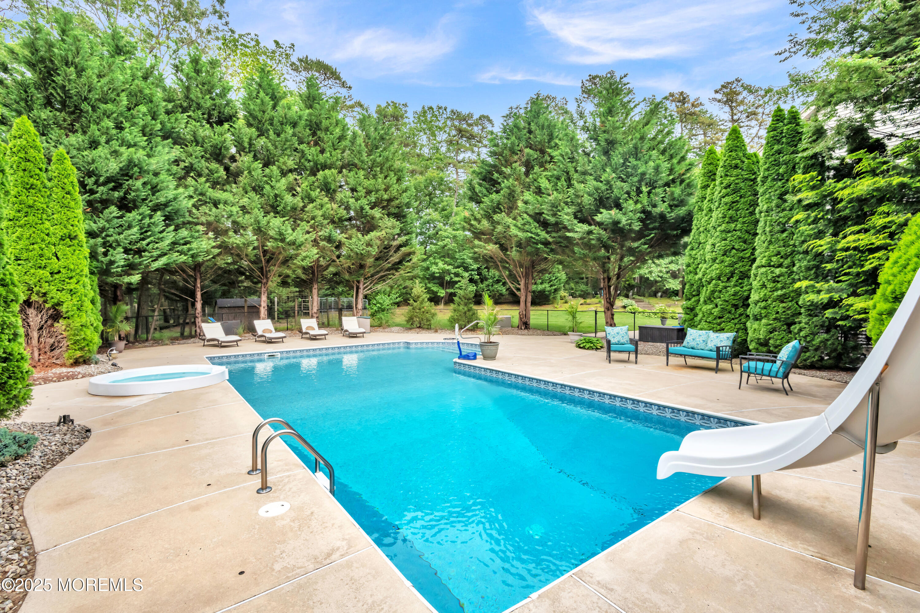 15 Conor Road Jackson, NJ 08527 - Photo 20 of 77 a view of a swimming pool with a lounge chairs