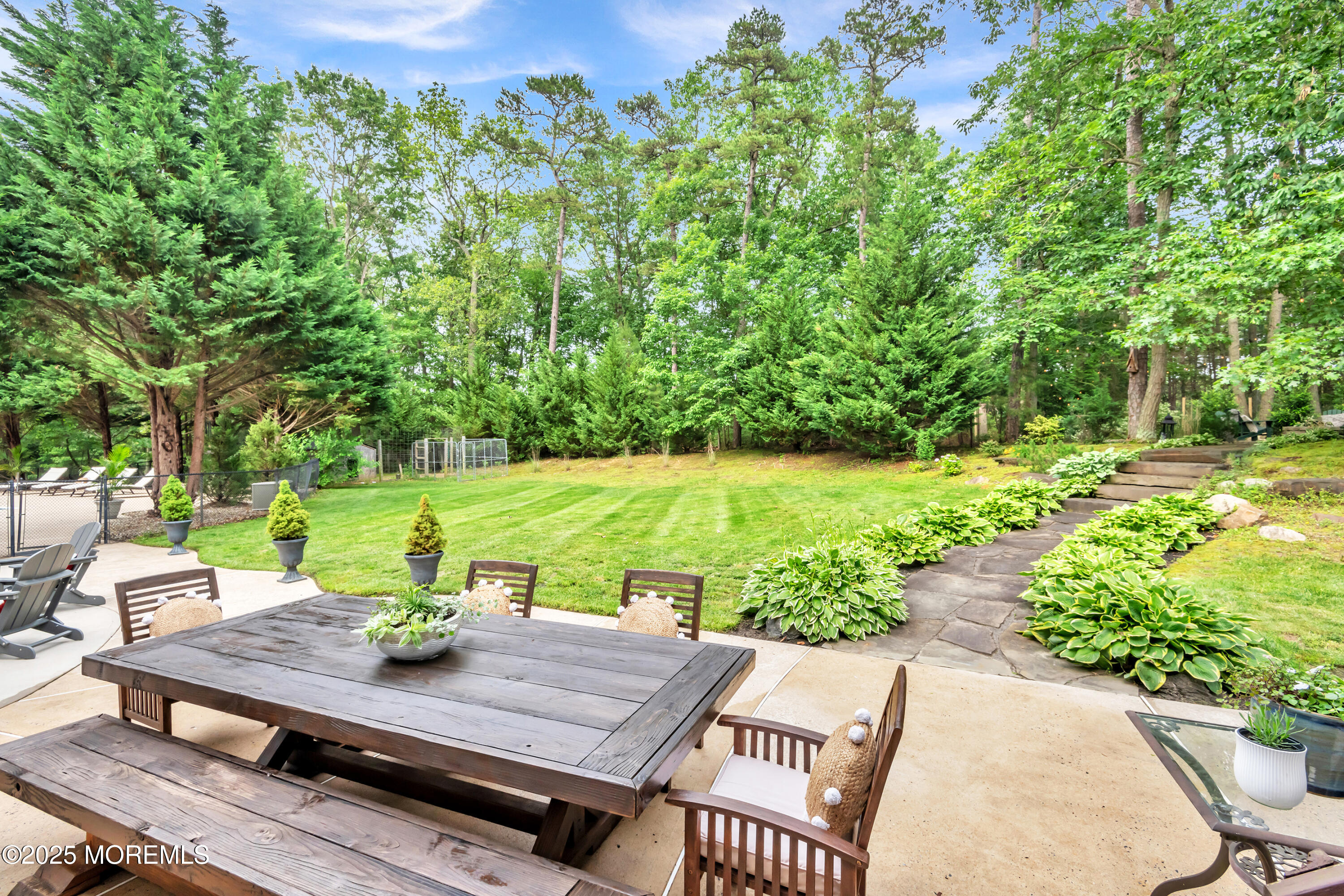 15 Conor Road Jackson, NJ 08527 - Photo 23 of 77 a view of a patio with table and chairs and potted plants